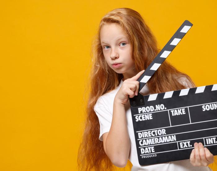 Girl_Holding_Clapper_board